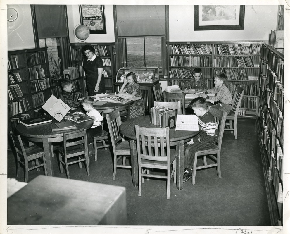 Patrons using the library space in 1923.